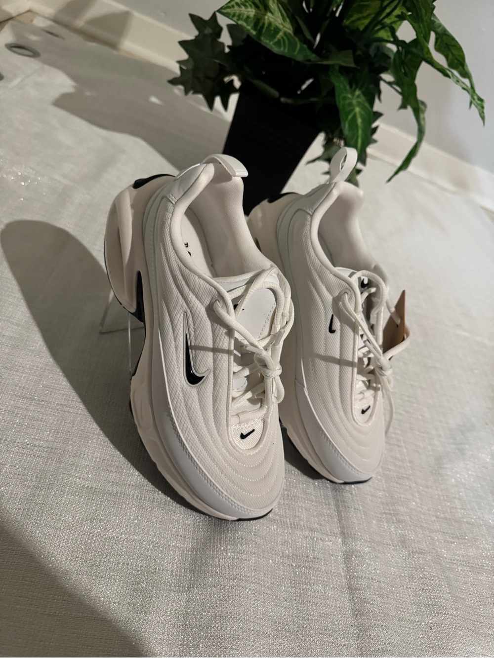 Nike Women’s Cream White Sneakers with Black Swoosh
